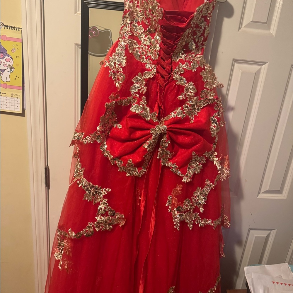 Elegant Red Backless Dress with Gold Accents